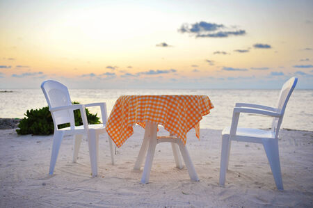 Romantic dining area next to a tropical beach in Maldivesの写真素材