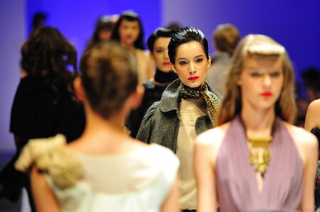 SINGAPORE - MAY 17: Models showcasing designs from Alldressedup at Audi Fashion Festival 2011 on May 17, 2011 in Singaporeのeditorial素材