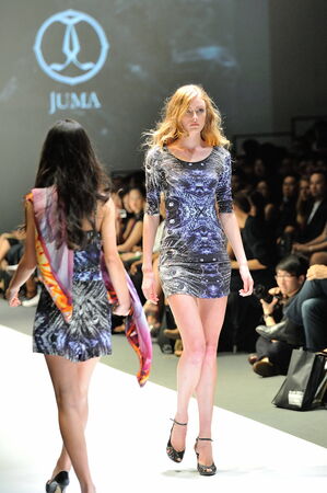 SINGAPORE - MAY 18: Model showcasing designs by Juma from Toronto at Audi Fashion Festival 2012 on May 18, 2012 in Singaporeのeditorial素材