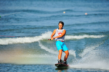 SINGAPORE - JULY 20: Athlete performing stunt during Rip Curl Singapore National Inter Varsity & Polytechnic Wakeboard Championship 2014 on July 20, 2014 in Singaporeのeditorial素材