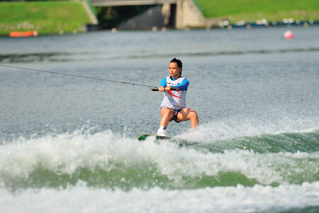SINGAPORE - JULY 20: Athlete performing stunt during Rip Curl Singapore National Inter Varsity & Polytechnic Wakeboard Championship 2014 on July 20, 2014 in Singaporeのeditorial素材