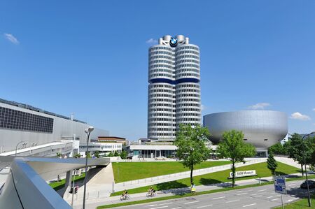 MUNICH - JUNE 8: Facade of BMW Museum and headquarters across a busy expressway on June 8, 2013 in Munichのeditorial素材