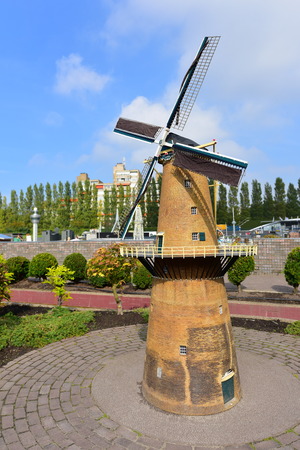 HAGUE - SEPTEMBER 19: Scaled replica of a windmill at Madurodam minature park, taken on September 19, 2014 in Hague, Netherlandsのeditorial素材