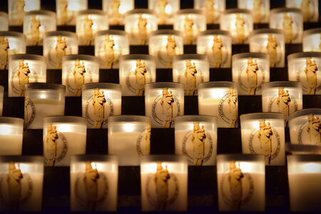 PARIS - SEPTEMBER 24: Candles burning in the famous Notre Dame de Paris cathedral, taken on...