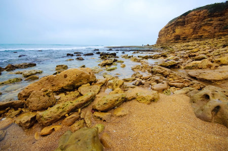 Cliff and beach along Great Ocean Drive in Australiaの写真素材