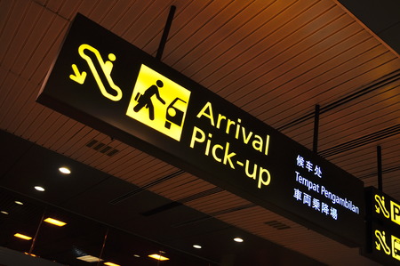 Arrival and pick-up signboard in airportの写真素材