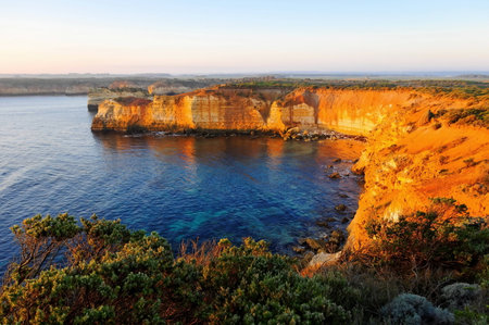 Steep cliffs and flat plains near Great Ocean Road, Australiaの写真素材