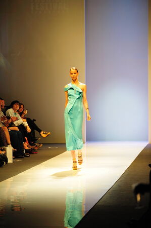 SINGAPORE - MAY 14: Model showcasing designs from Swarovski at Audi Fashion Festival 2011 on May 14, 2011 in Singaporeのeditorial素材