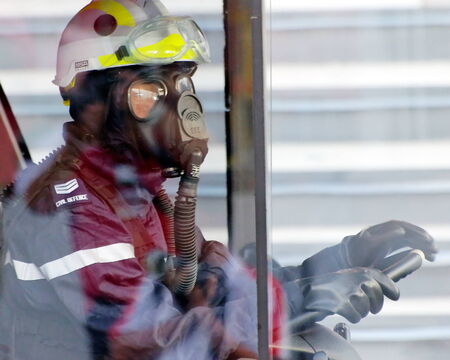 SINGAPORE - AUGUST 09: Fireman in chemical protective suit during Singapore National Day Parade 2009...