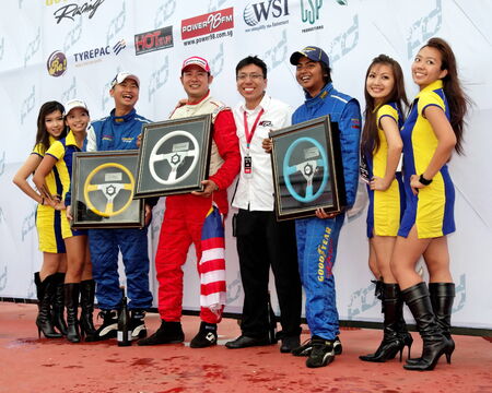SINGAPORE - JULY 05: Winners of Formula Drift Singapore 2009 Pro-am Series pose for photographers July 05, 2009 in Singaporeのeditorial素材