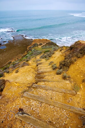 Cliff and beach along Great Ocean Drive in Australiaの写真素材
