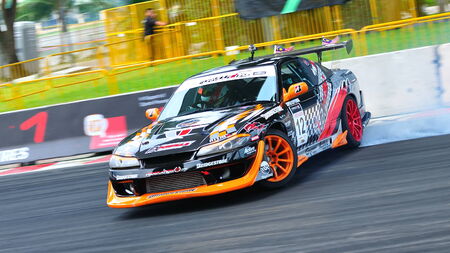 SINGAPORE - APRIL 24: Tengku Djan Ley from Team FX Formula Bridgestone drifting at Singapore Formula Drift at F1 Pit Building April 24, 2010 in Singaporeのeditorial素材