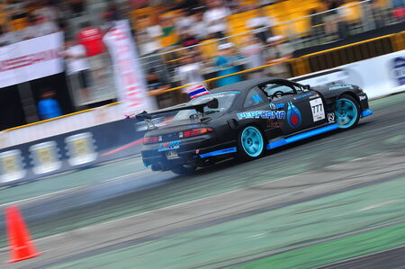 SINGAPORE - APRIL 24: Auttapon Prakopkong from PTT team drifting at Singapore Formula Drift at F1 Pit Building April 24, 2010 in Singaporeのeditorial素材