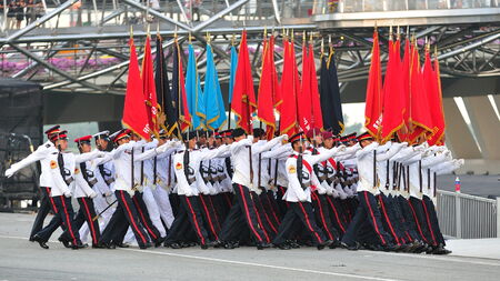 SINGAPORE - JUNE 25: Colors party marching at National Day Parade Singapore 2011 Combined Rehearsal on June 25, 2011 in Singapore.のeditorial素材
