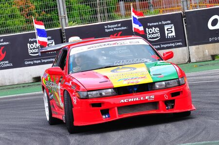 SINGAPORE - APRIL 25: Davide Dorigo from PTT team parading in his Nissan Silvia drift car at...