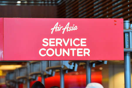 SINGAPORE - JANUARY 10:  AirAsia service counter at Changi Airport on January 10, 2015 in Singaporeのeditorial素材