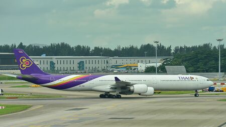 SINGAPORE - JANUARY 10: Thai Airways Airbus A340-600 quad-jet taxiing at Changi Airport on January 10, 2015 in Singaporeのeditorial素材
