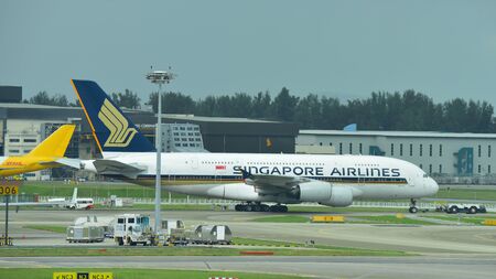 SINGAPORE - JANUARY 10: Singapore Airlines Airbus 380 super jumbo being towed across taxi-way at Changi Airport on January 10, 2015 in Singaporeのeditorial素材