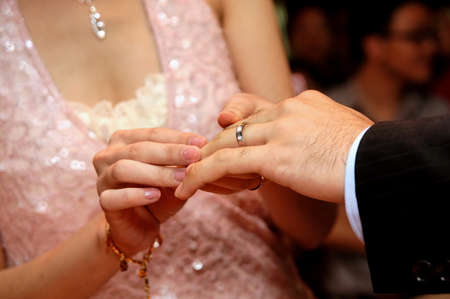 Exchanging wedding ringsの写真素材