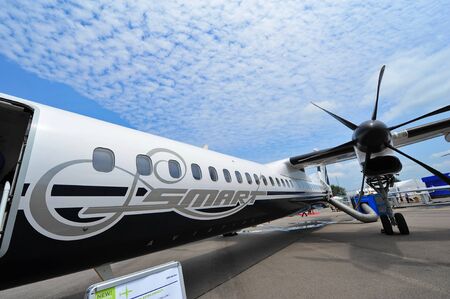 SINGAPORE - FEBRUARY 12: Bombardier Q400 nextgen turboprop regional plane on display at Singapore Airshow February 12, 2014 in Singaporeのeditorial素材