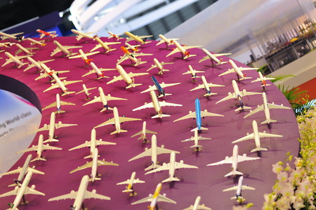 SINGAPORE - FEBRUARY 9: Booth of Changi Airport Group (CAG) showcasing aircraft models at Singapore Airshow February 9, 2014 in Singaporeのeditorial素材