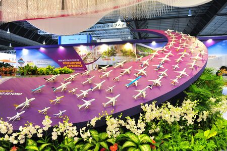 SINGAPORE - FEBRUARY 9: Booth of Changi Airport Group (CAG) showcasing aircraft models at Singapore Airshow February 9, 2014 in Singaporeのeditorial素材