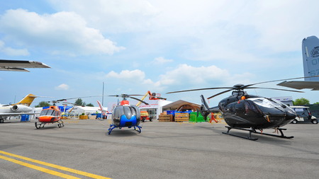 SINGAPORE - FEBRUARY 9: Various models of Airbus (previously Eurocopter) helicopters on display at Singapore Airshow February 9, 2014 in Singaporeのeditorial素材