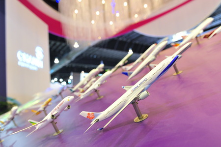 SINGAPORE - FEBRUARY 9: Booth of Changi Airport Group (CAG) showcasing aircraft models at Singapore Airshow February 9, 2014 in Singaporeのeditorial素材
