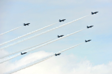 SINGAPORE - FEBRUARY 9: Aerobatic flying display by Black Eagles from the Republic of Korean Air Force (ROKAF) at Singapore Airshow February 9, 2014 in Singaporeのeditorial素材