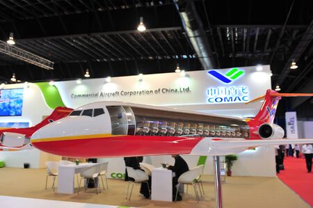 SINGAPORE - FEBRUARY 12: Commercial of Aircraft Corporation of China (COMAC) booth showcasing ARJ21...