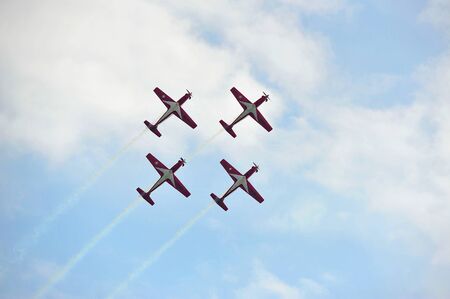 SINGAPORE - FEBRUARY 9: Aerobatic flying display by TNI-AU Jupiter Aerobatic Team from Indonesia at Singapore Airshow February 9, 2014 in Singaporeのeditorial素材