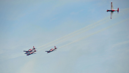 SINGAPORE - FEBRUARY 9: Aerobatic flying display by TNI-AU Jupiter Aerobatic Team from Indonesia at Singapore Airshow February 9, 2014 in Singaporeのeditorial素材