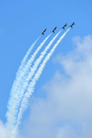 SINGAPORE - FEBRUARY 16:  RKAF Black Eagles Aerobatic Team aerobatic performance at Singapore Airshow February 16, 2016 in Singaporeのeditorial素材