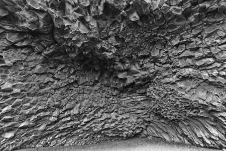 Basalt rock cave at Kirkjufjara Beach in Icelandの写真素材