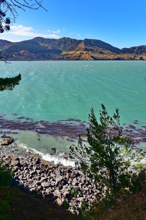 Scenic landscape of the sea and hills at Diamond Harbour in Canterbury, New Zealand