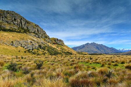 Mount Sunday and surrounding mountain ranges, used in filming Lord of the Rings movie Edoras scene, in Canterbury, New Zealandの写真素材