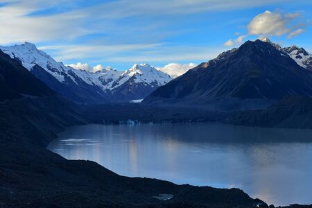 A shrinking Tasman Glacier and surrounding snow mountains in Canterbury, New Zealandの写真素材