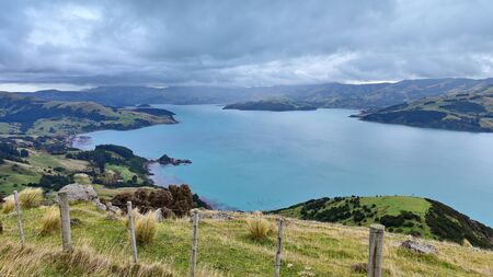 Panoramic view of scenic Banks Peninsula, famous for its bays, in Canterbury, New Zealandの写真素材