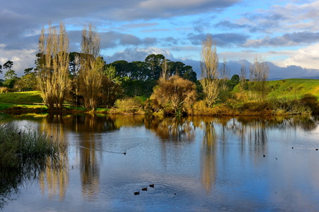 MATAMATA, NEW ZEALAND - AUGUST 2017: Lake in Hobbiton movie set featured in Lord of the Rings and Hobbit movies on August 27, 2017 in Matamataのeditorial素材