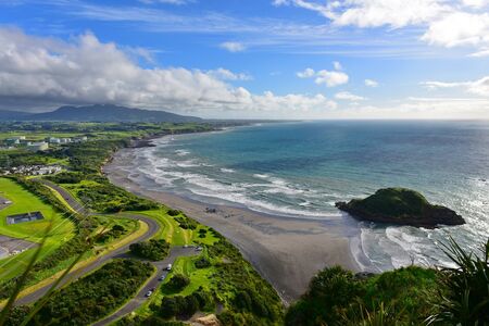 Aerial view of New Plymouth and the coastline from Paritutu Rock in New Plymouth, New Zealandの写真素材