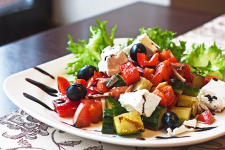 Greek Mediterranean salad with feta cheese, olives and peppers の写真素材