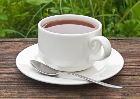 cup of tea on the old wooden tableの写真素材