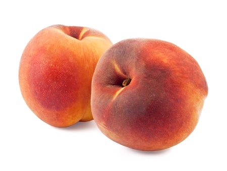 two fresh peaches isolated on white backgroundの写真素材