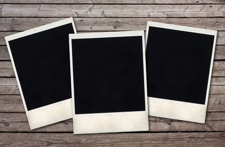 old photo frames on the wooden wall の写真素材