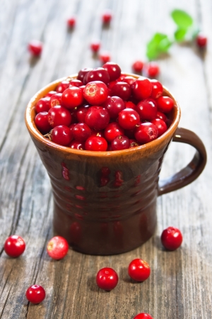 fresh red berries on wooden tableの写真素材