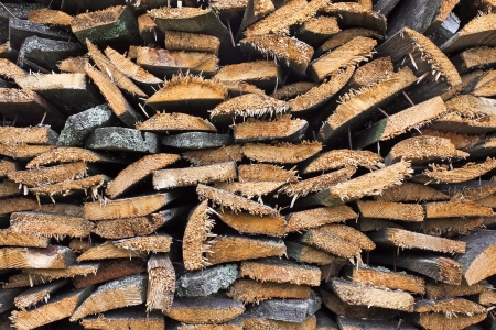 Stack of old firewood, wooden abstract backgroundの写真素材