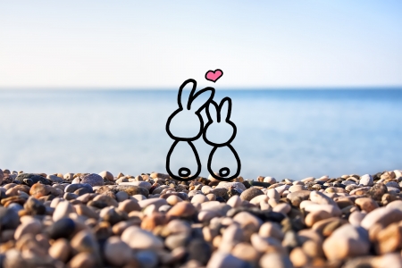 Happy couple in love against blue sky backgroundの写真素材