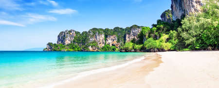 Panorama of thai traditional wooden longtail boat and beautiful sand Railay Beach in Krabi province. Ao Nang, Thailand.の写真素材