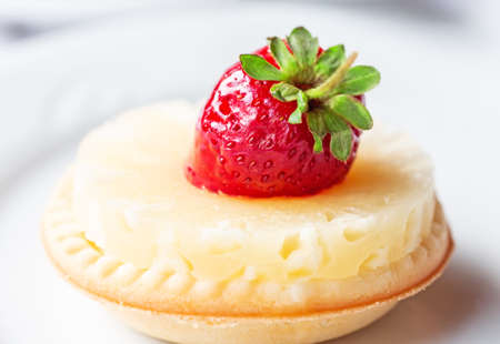 Strawberry Cake Dessert on White Background. Piece of Strawberry Cake on a white plate with fresh strawberrie.の写真素材
