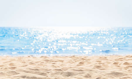 Panorama of a beautiful white sand beach and turquoise water in Maldives. Blur bokeh light of calm...